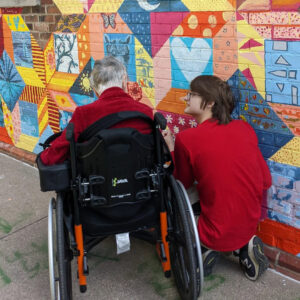community members painting the Welcome In Mural at Silver Spire United Church